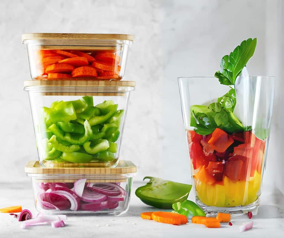 Glass food storage containers holding vegetables, a safe non-toxic alternative to plastic. Glass food storage containers are safer than plastic